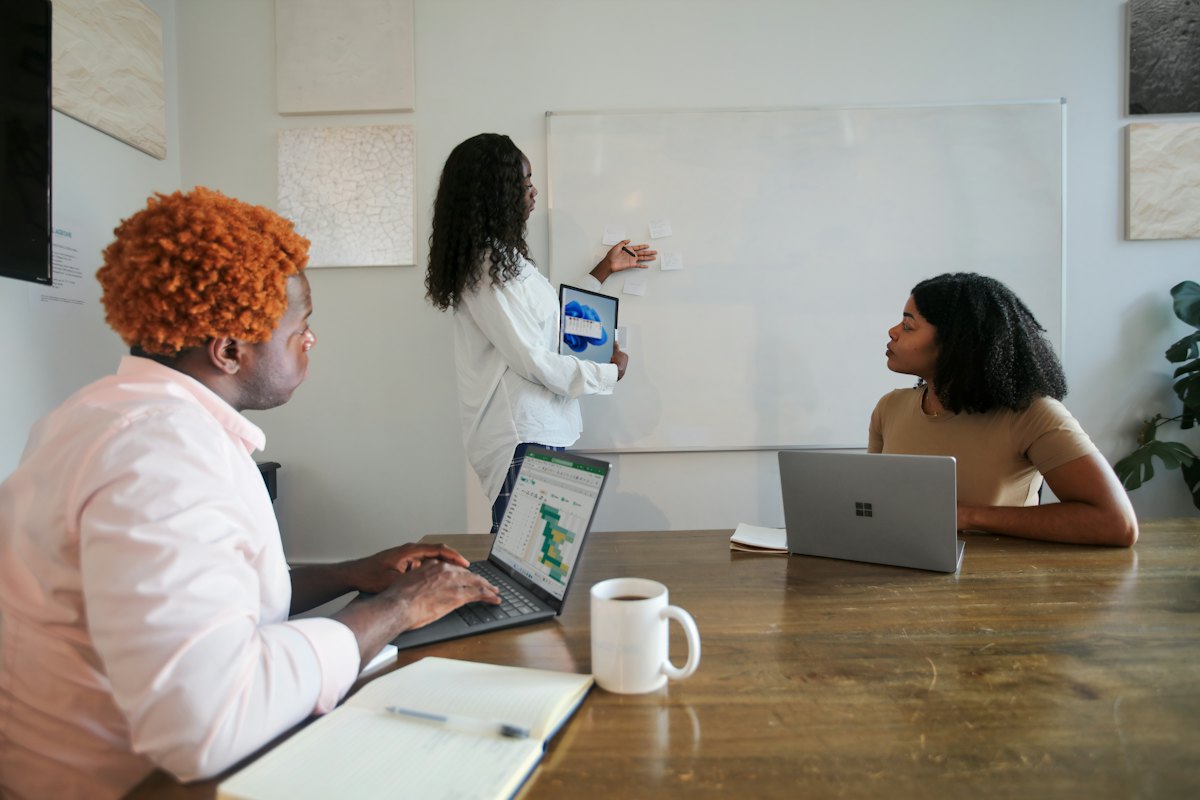 Developers working together on laptops